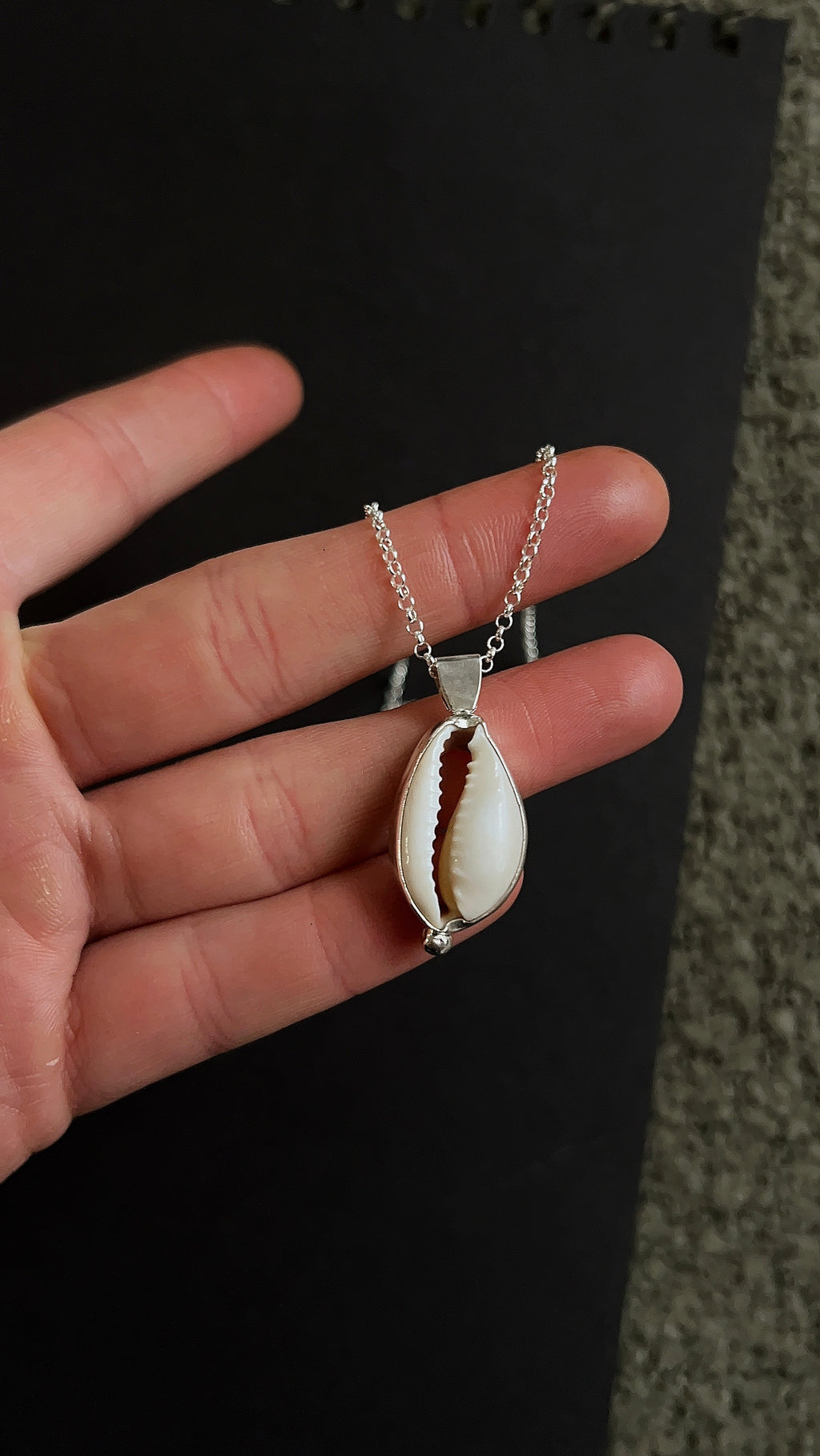 cowrie pendant necklace with accent detail