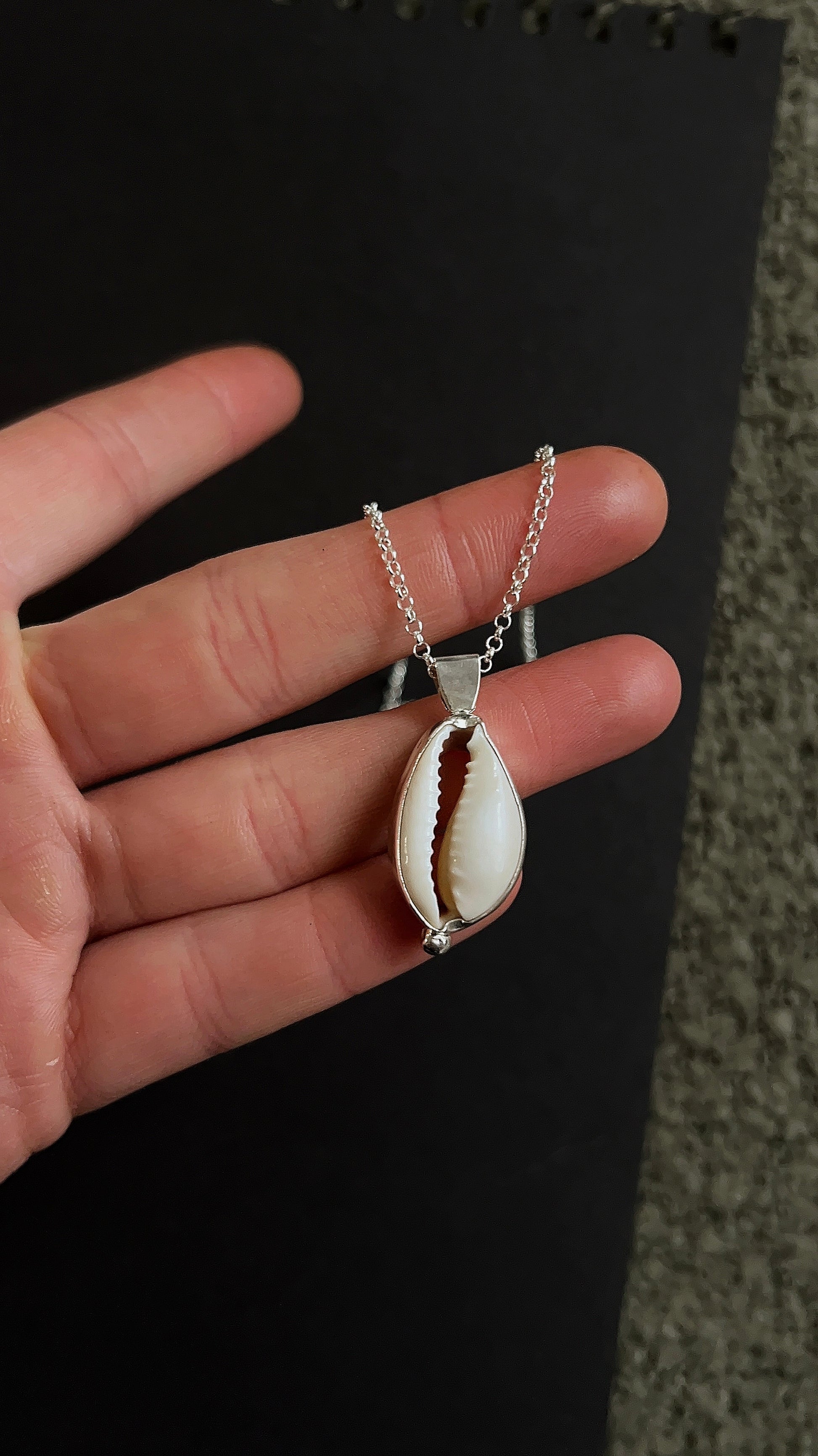 cowrie pendant necklace with accent detail