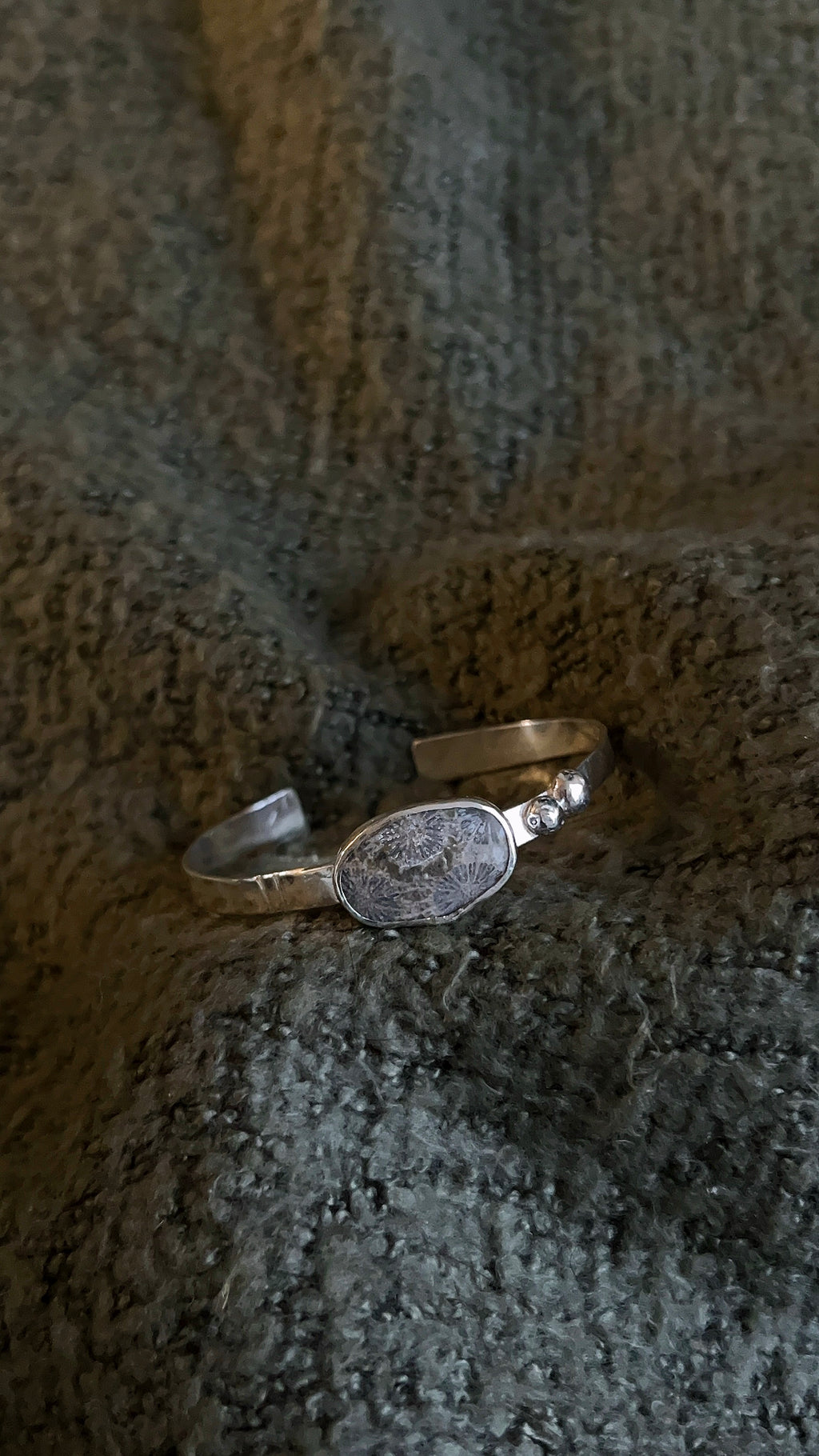 fossil coral thick cuff bracelet with accent details