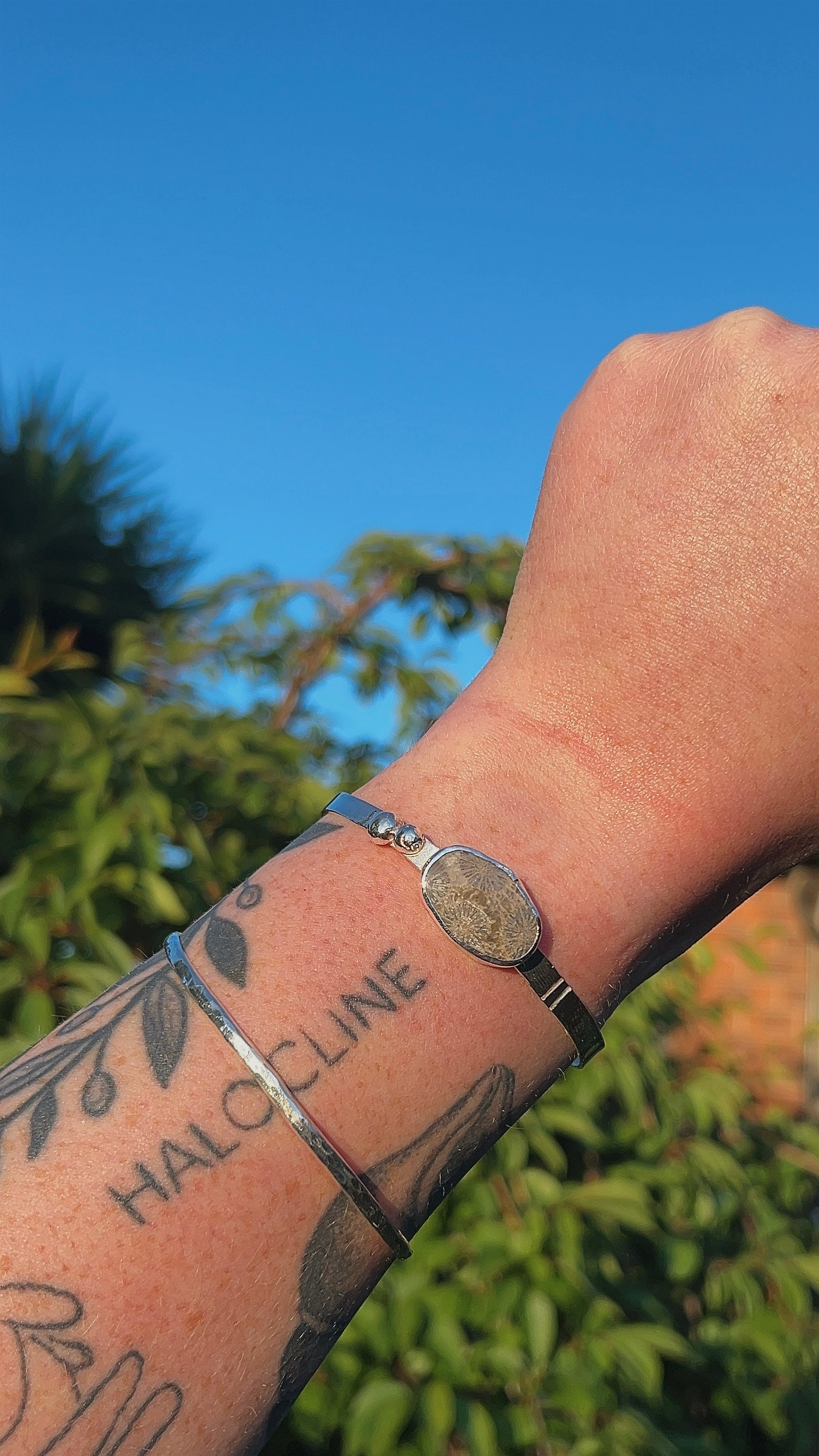 fossil coral thick cuff bracelet with accent details