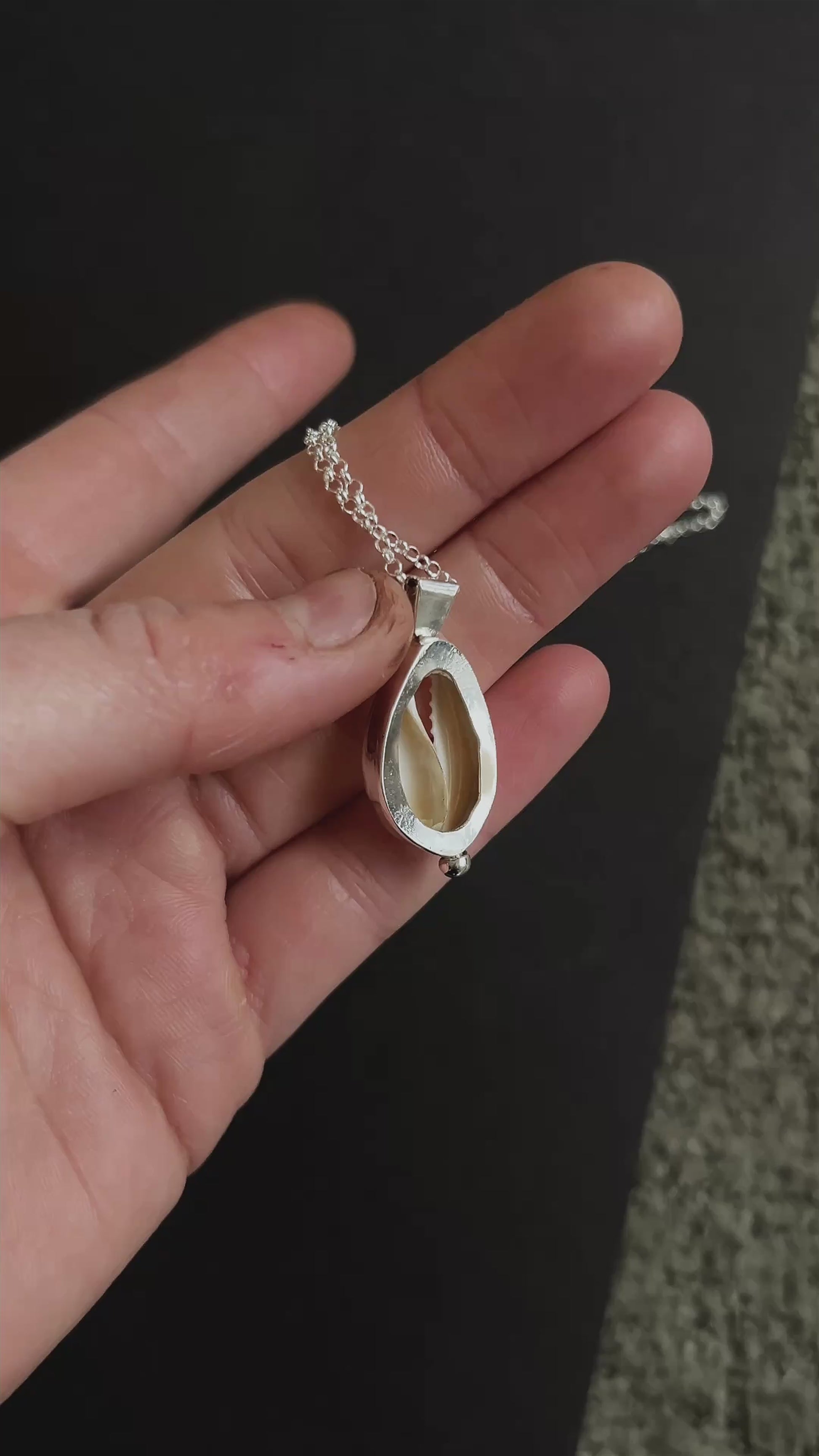 cowrie pendant necklace with accent detail